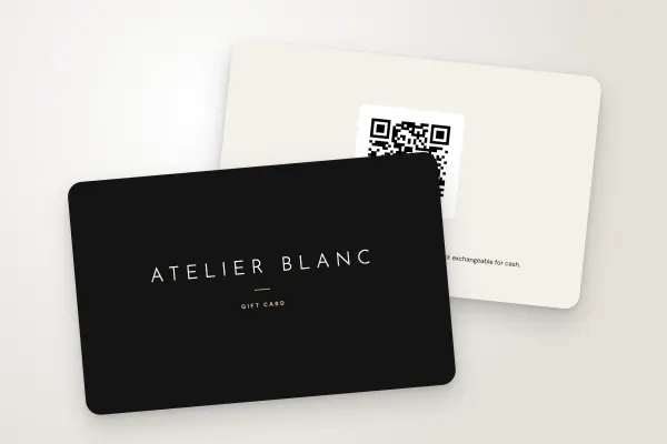 gift card template “Atelier Blanc” (hair salons, beauty salons and spas, spaced capitals, black and champagne): front and back