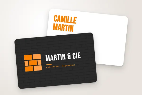 Modèle de carte de visite « Martin & Cie » (artisans et bâtiment, monogramme en briques, anthracite et orange) : recto et verso