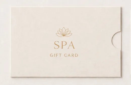 Die-cut paper sleeve with window holding a gift card