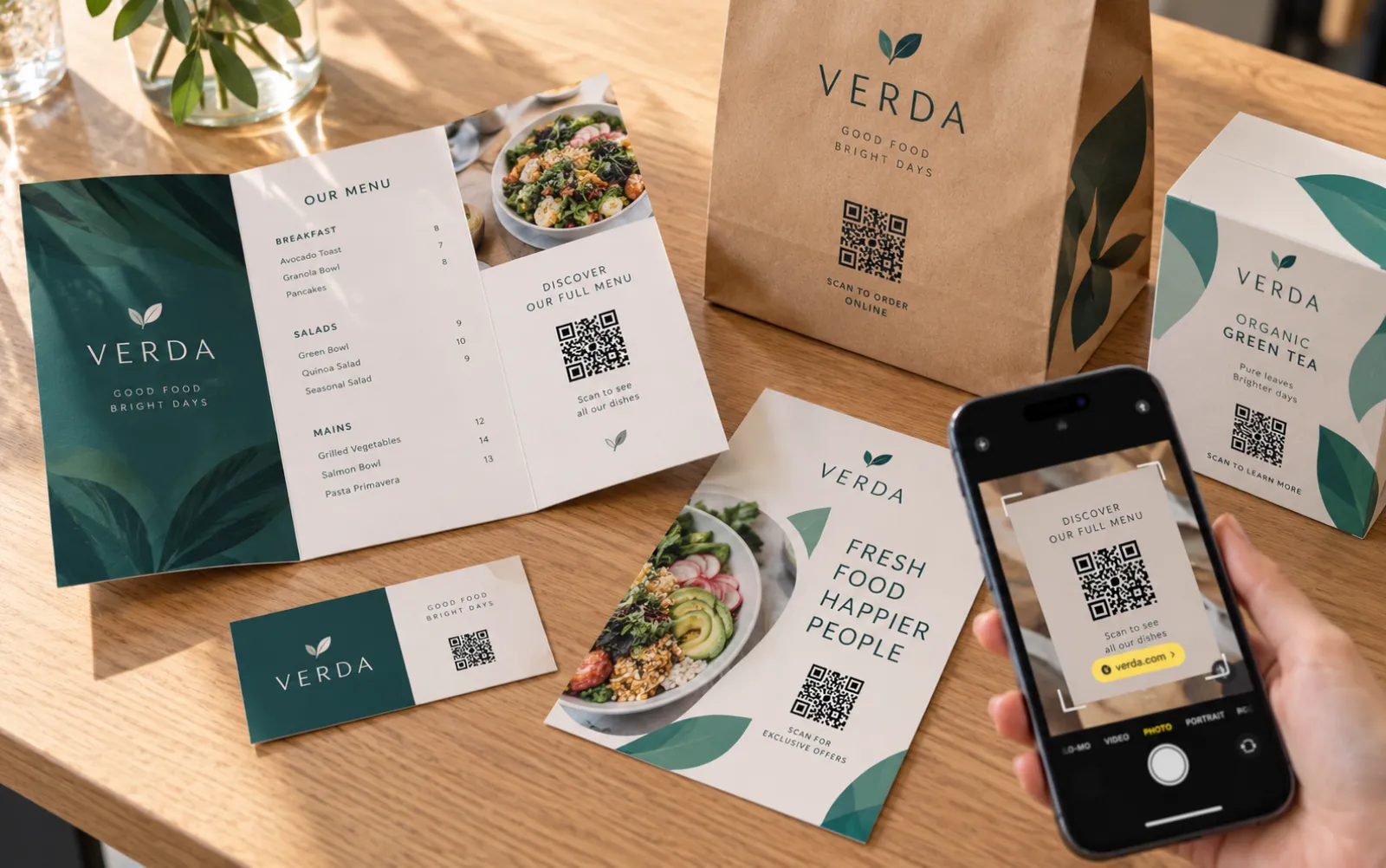 The same dynamic QR code on a menu, a bag, a box and a flyer